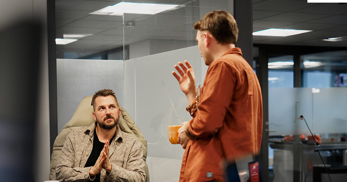 developer and marketing specialist discussing